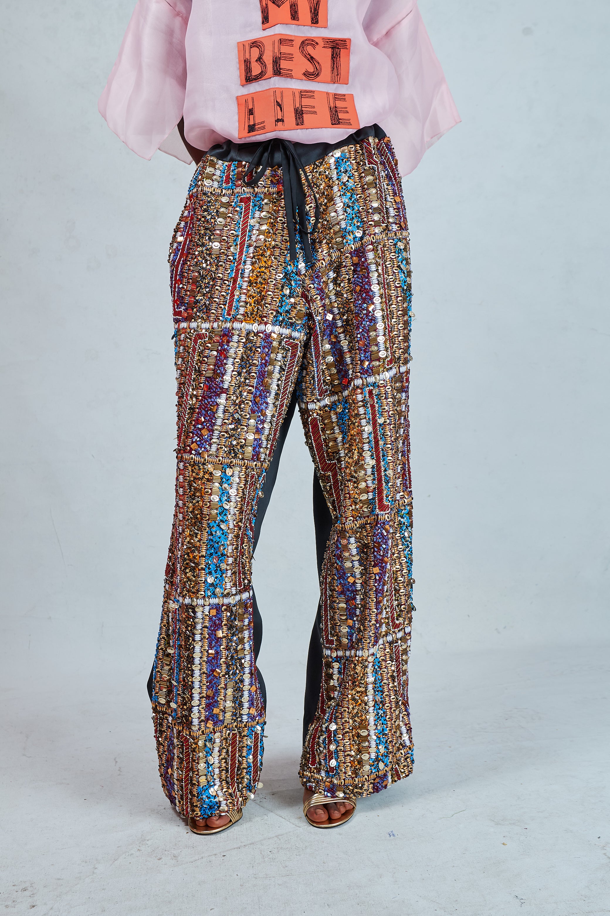 Odio Mimonet Beaded Pants wide-leg multicolour beaded trousers with gold blue and brown handcrafted beadwork luxury African designer, front view